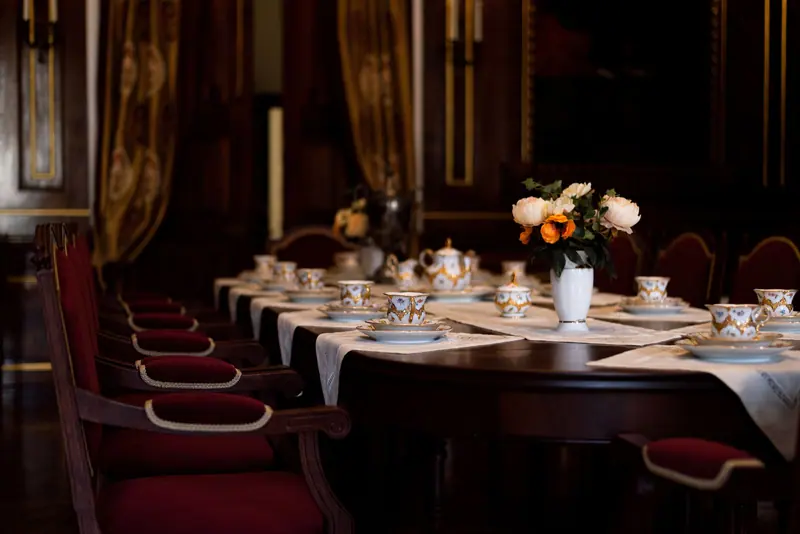 The private dining room set with china and roses