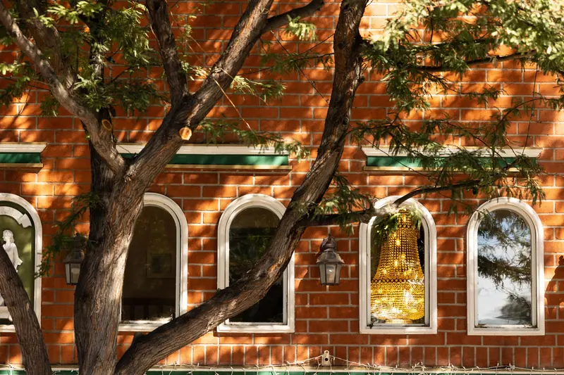 Arched windows on the old brick wall of the east wing