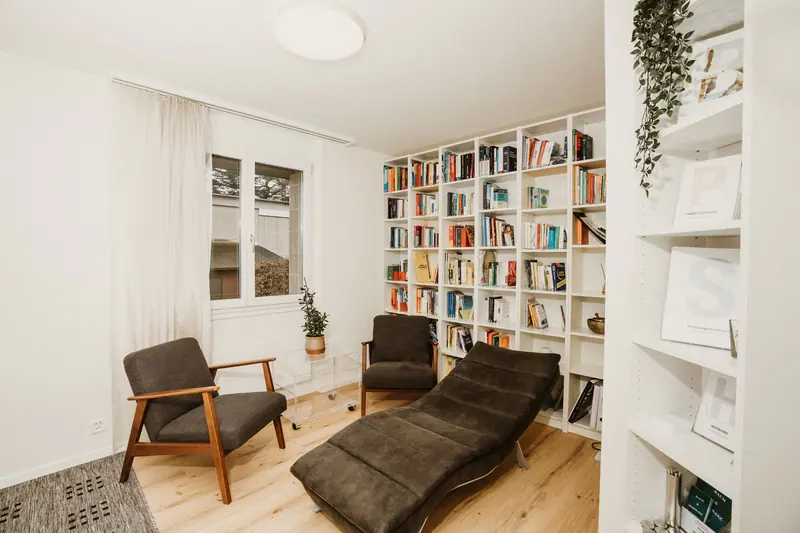 A quiet reading room with full bookshelves