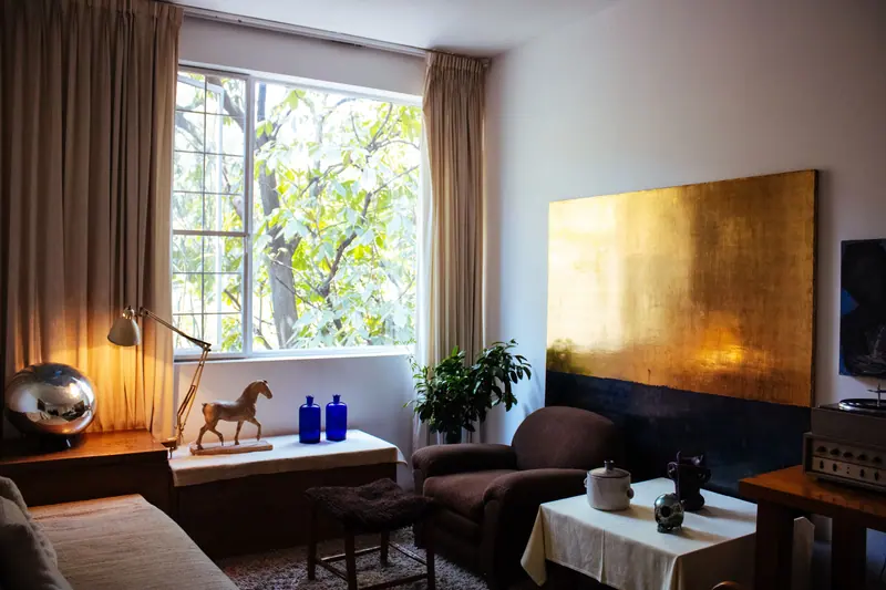 A tranquil living room featuring modern classic decor and natural light.