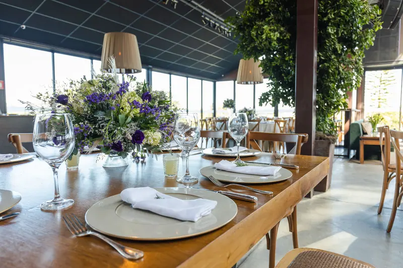 The dining room set for lunch beneath the skylights