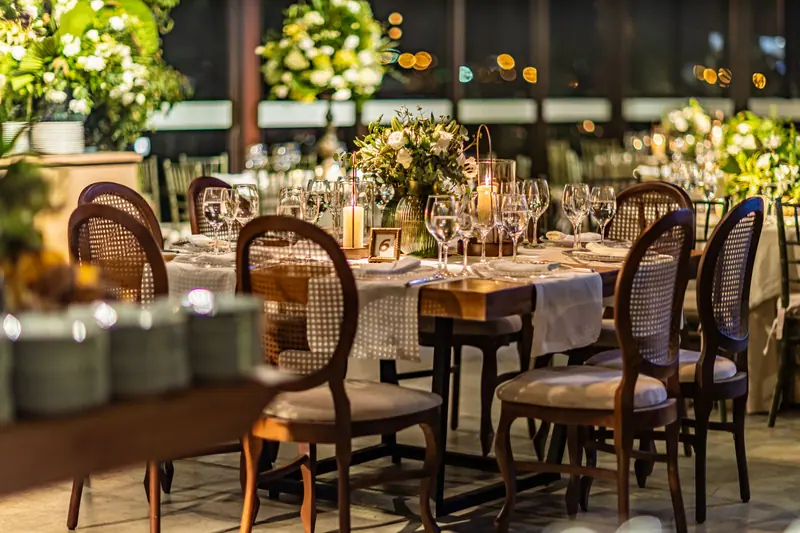 Long tables in the bistro, set for a family dinner