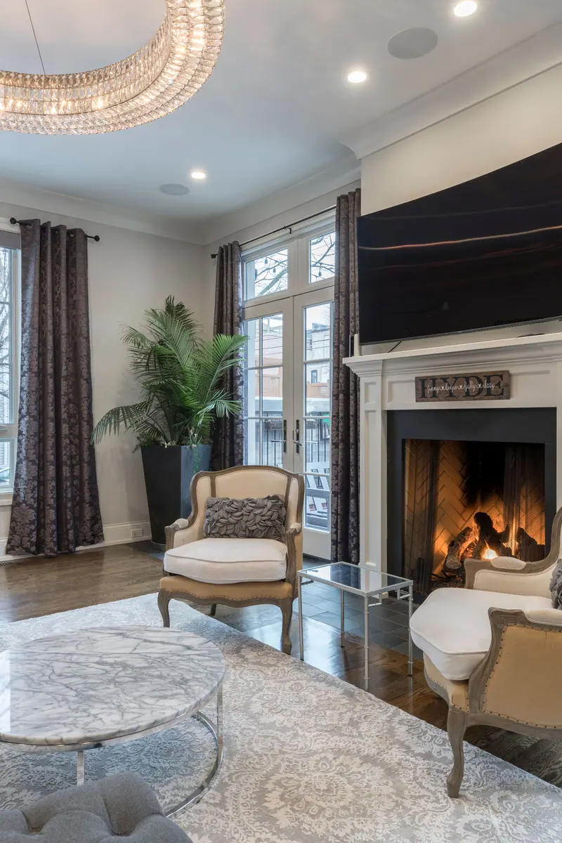 An armchair by the fireplace in the front hall