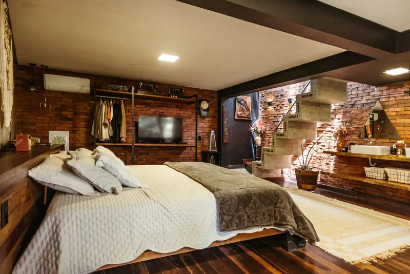 A loft bedroom tucked under the stairs