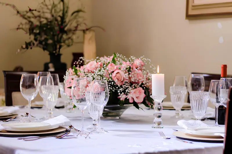 A table dressed with roses for an anniversary dinner