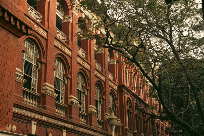 Brick cornices and arched windows on the front of Old Main