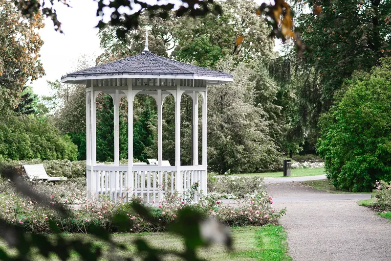 The white gazebo at the end of the garden path
