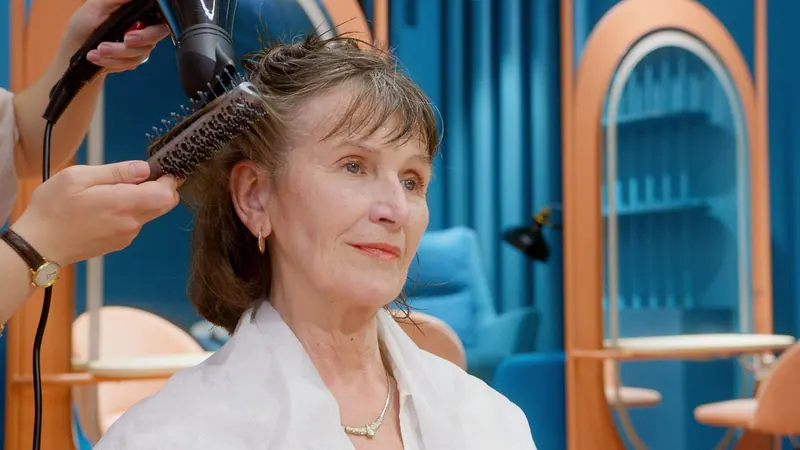 A resident getting her hair done at the Tuesday beauty shop
