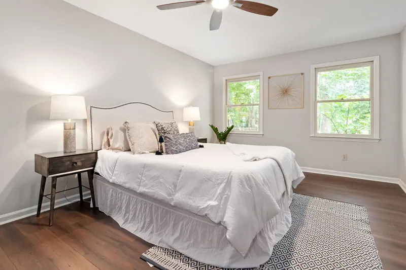 Bright and cozy minimalist bedroom with elegant decor and natural light.