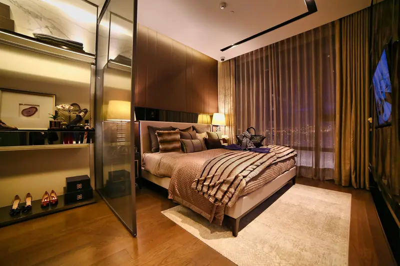 Cozy luxurious bedroom with modern design, warm lighting, and elegant decor.