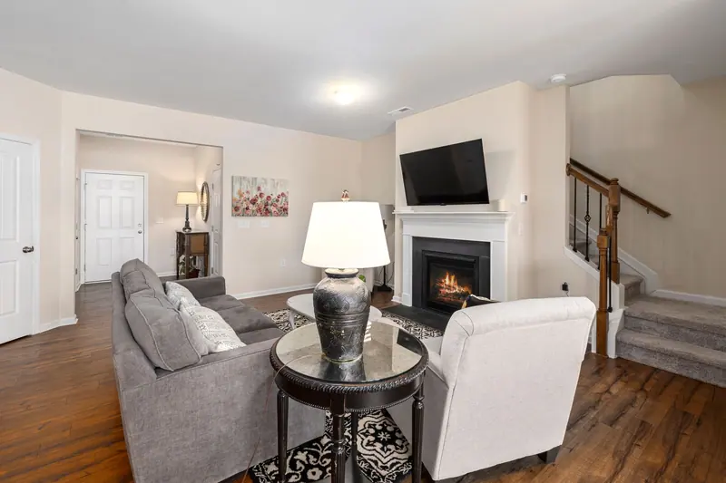 A cottage den with a gas fireplace
