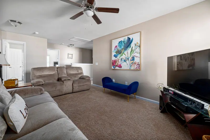 A cottage living room with plush seating