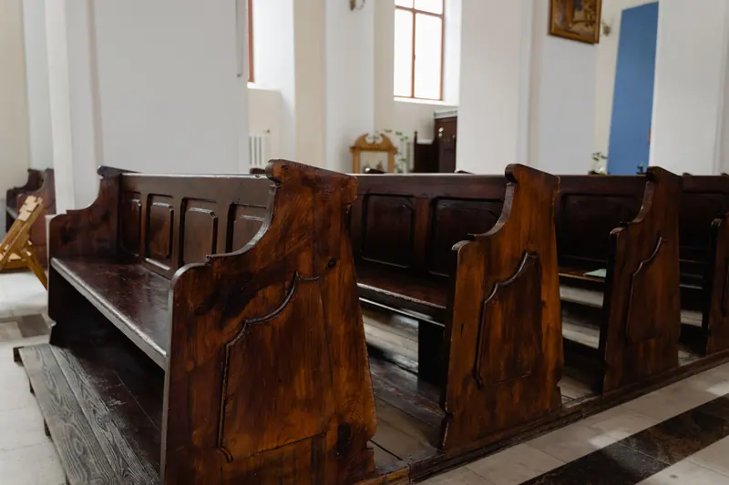 Old wooden pews at the church down the street