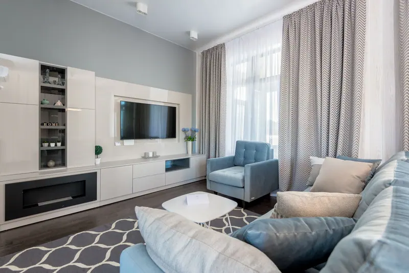 A Redbud one-bedroom living room with a blue sofa