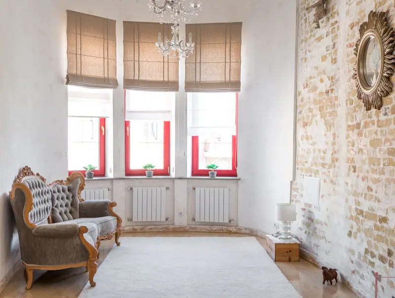 Beautiful vintage living room featuring an elegant armchair and chandelier. Perfect for classic decor enthusiasts.