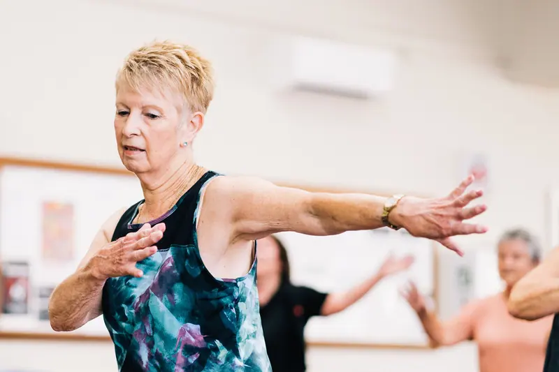 A resident stretching in the gym