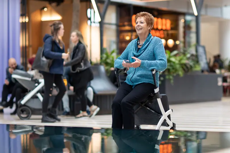 A resident and her daughter out with her walker