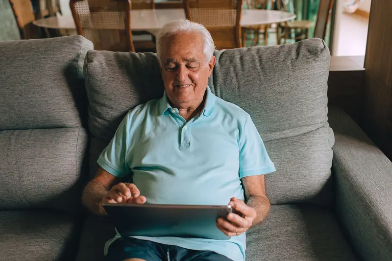 A guest video-calling family from his armchair