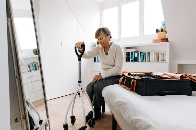 A guest packing her bag on the morning she goes home
