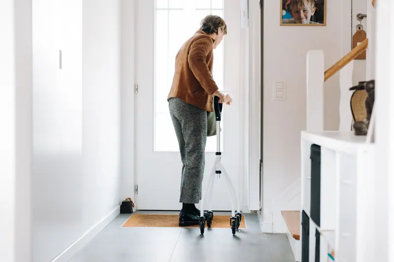 Walking to the door with a walker