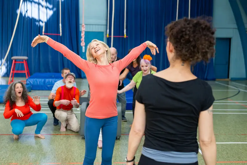 A group exercise class with ribbons