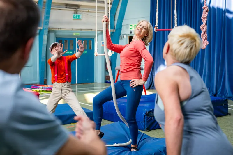 Patients cheering each other on in the balance and strength class