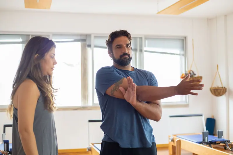 A therapist leading a shoulder stretch
