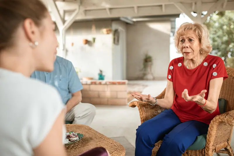 A resident telling a story to her visiting daughter