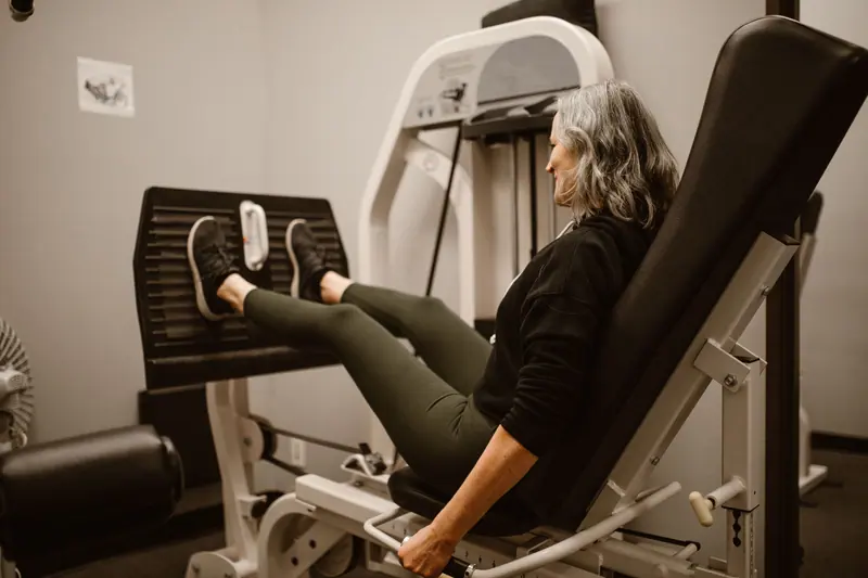 A patient pushing through a set on the leg press