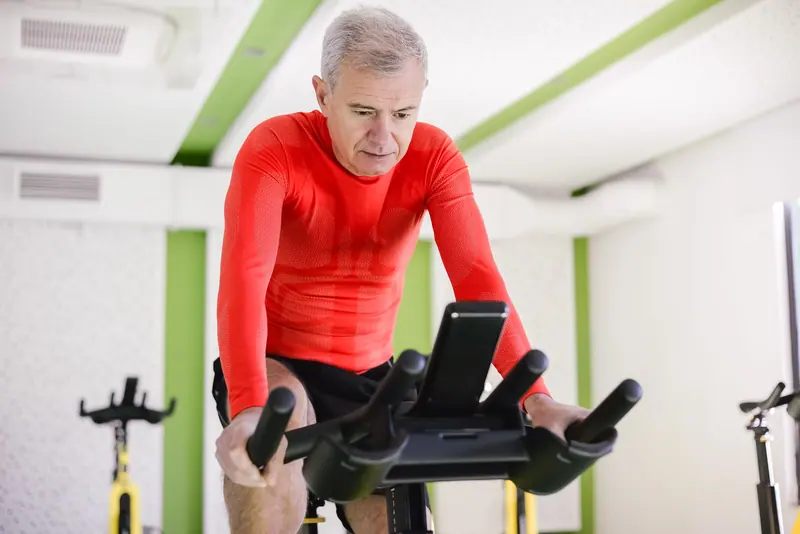 A patient warming up on the stationary bike