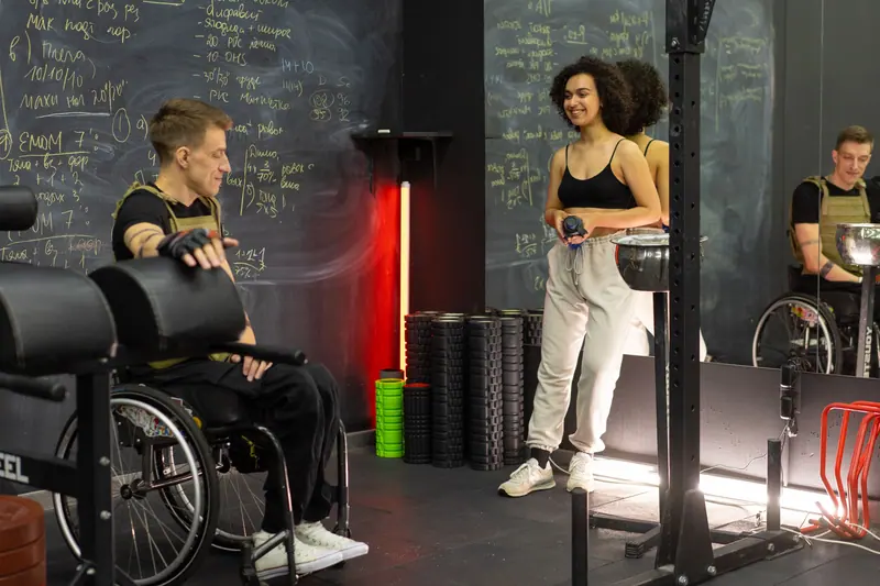 A guest working out from his wheelchair in the gym