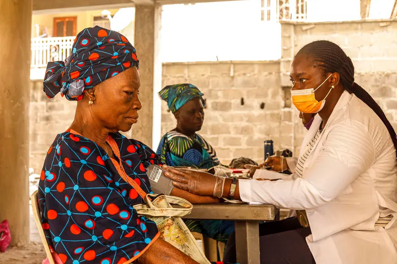 A nurse taking a patient's blood pressure