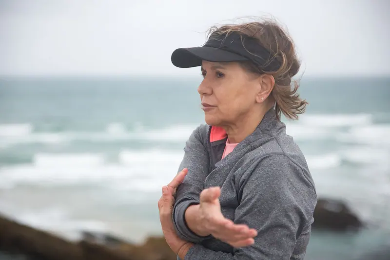 A former patient doing her home exercise program outdoors