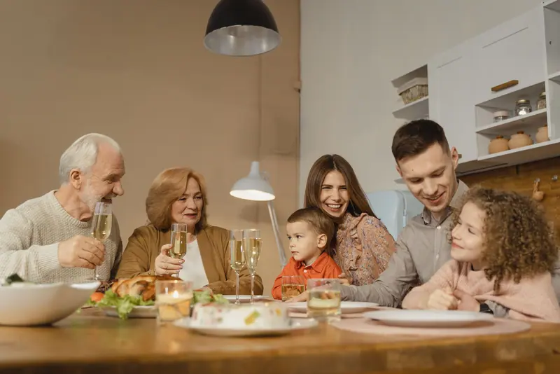 A family toasting at Sunday lunch