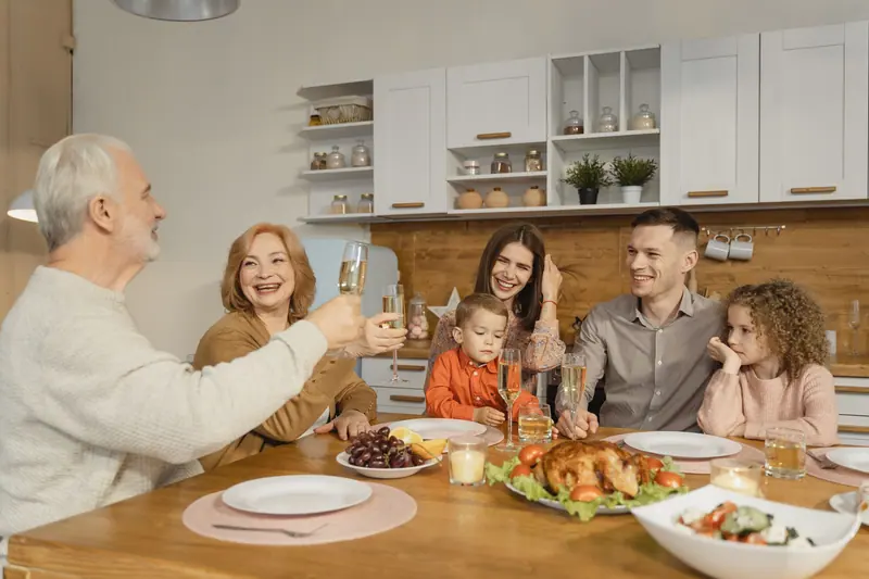 Family gathered around the table for Thanksgiving dinner