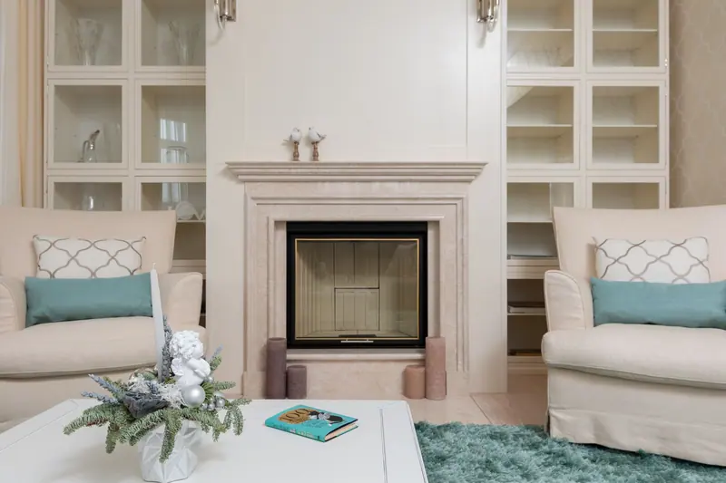 The parlor fireplace and built-in cabinets