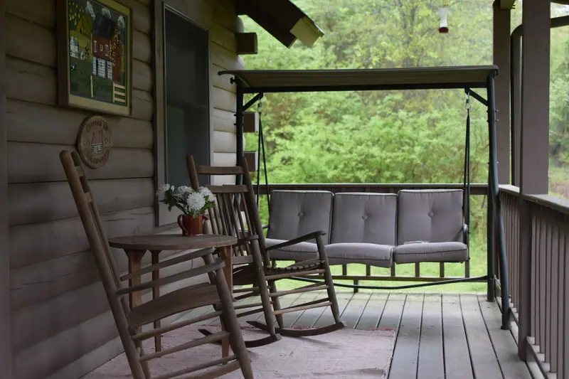 The porch swing and rocking chairs