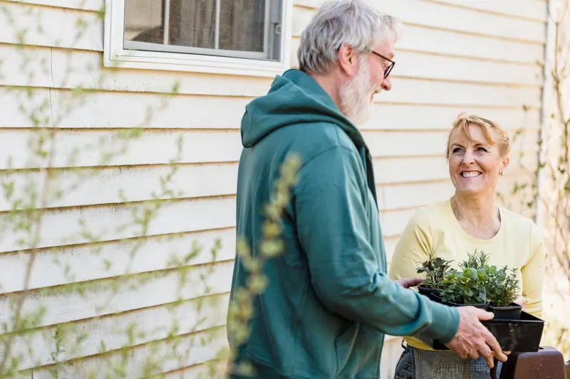 A couple gardening together