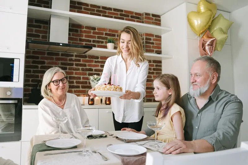 Grandparents and grandchildren around the table on a Sunday visit