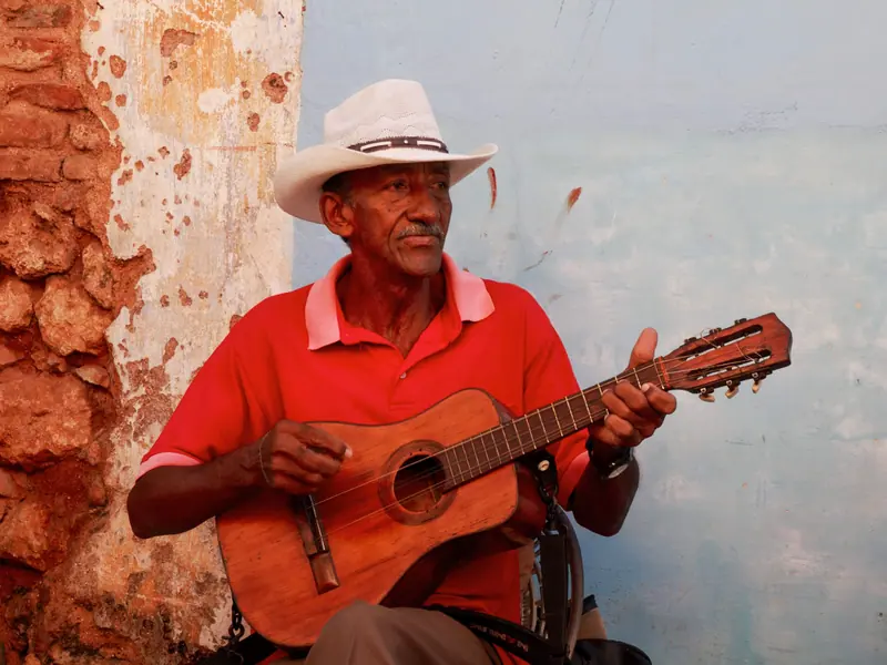 A visiting picker playing guitar on music night