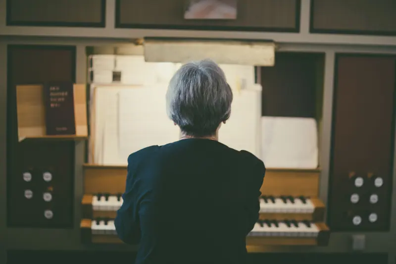 A resident at the organ in the chapel