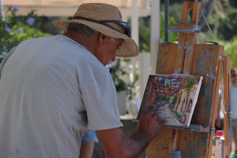 A resident at his easel painting the view