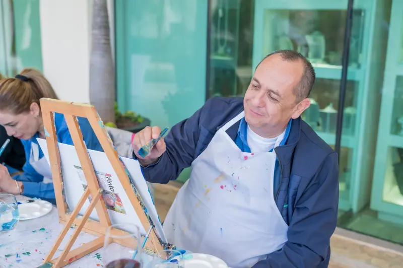 Residents at their easels during the Thursday painting class