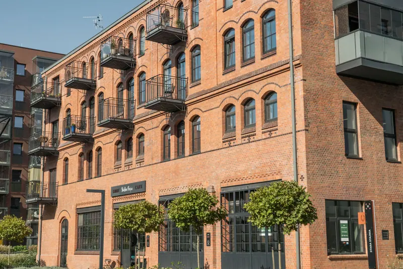 The restored brick foundry building with its iron balconies