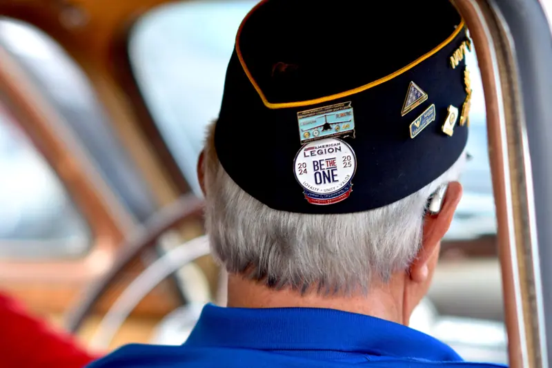 A resident in his American Legion cap on the way to Veterans Day ceremonies