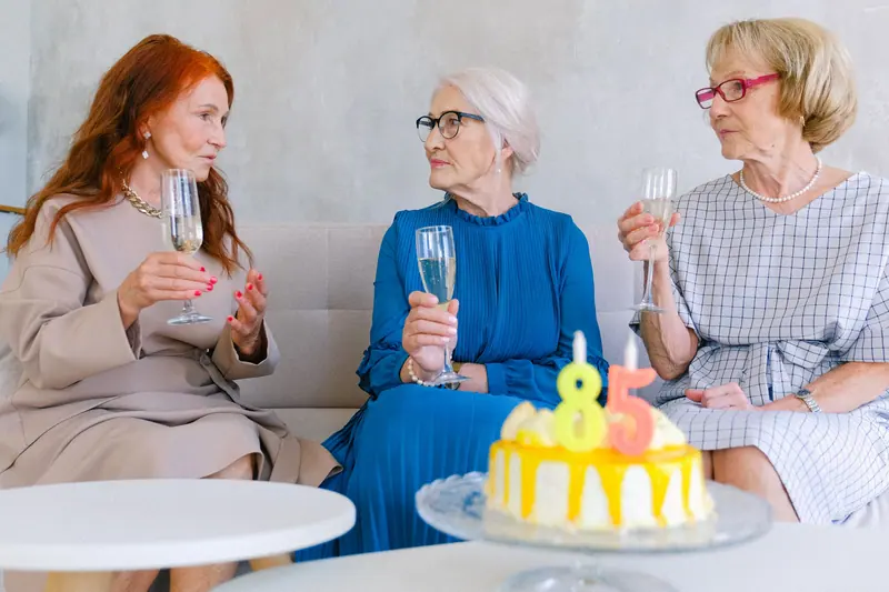 Three friends celebrating an eighty-fifth birthday