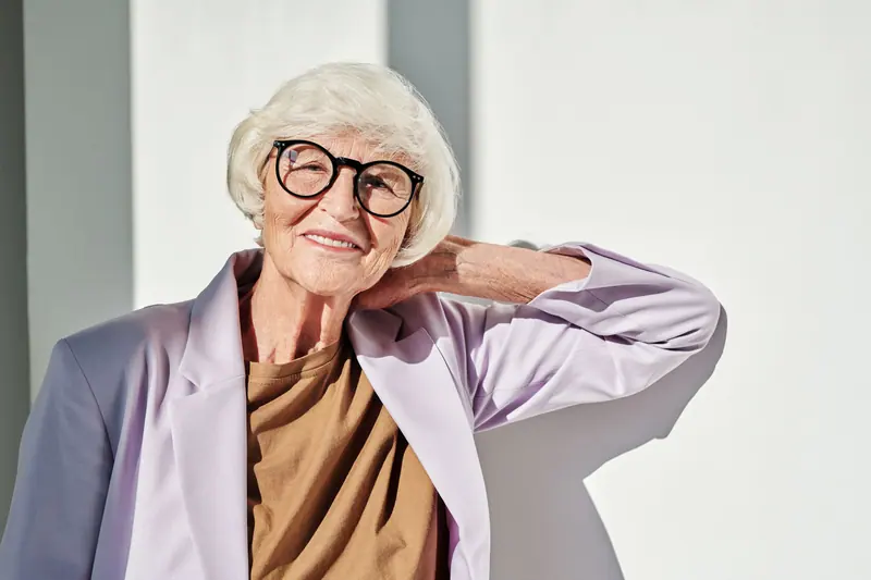 A resident in her lilac jacket, ready for the market