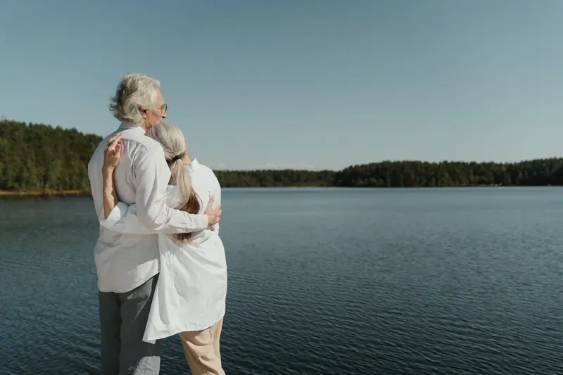 A couple embracing at the water's edge