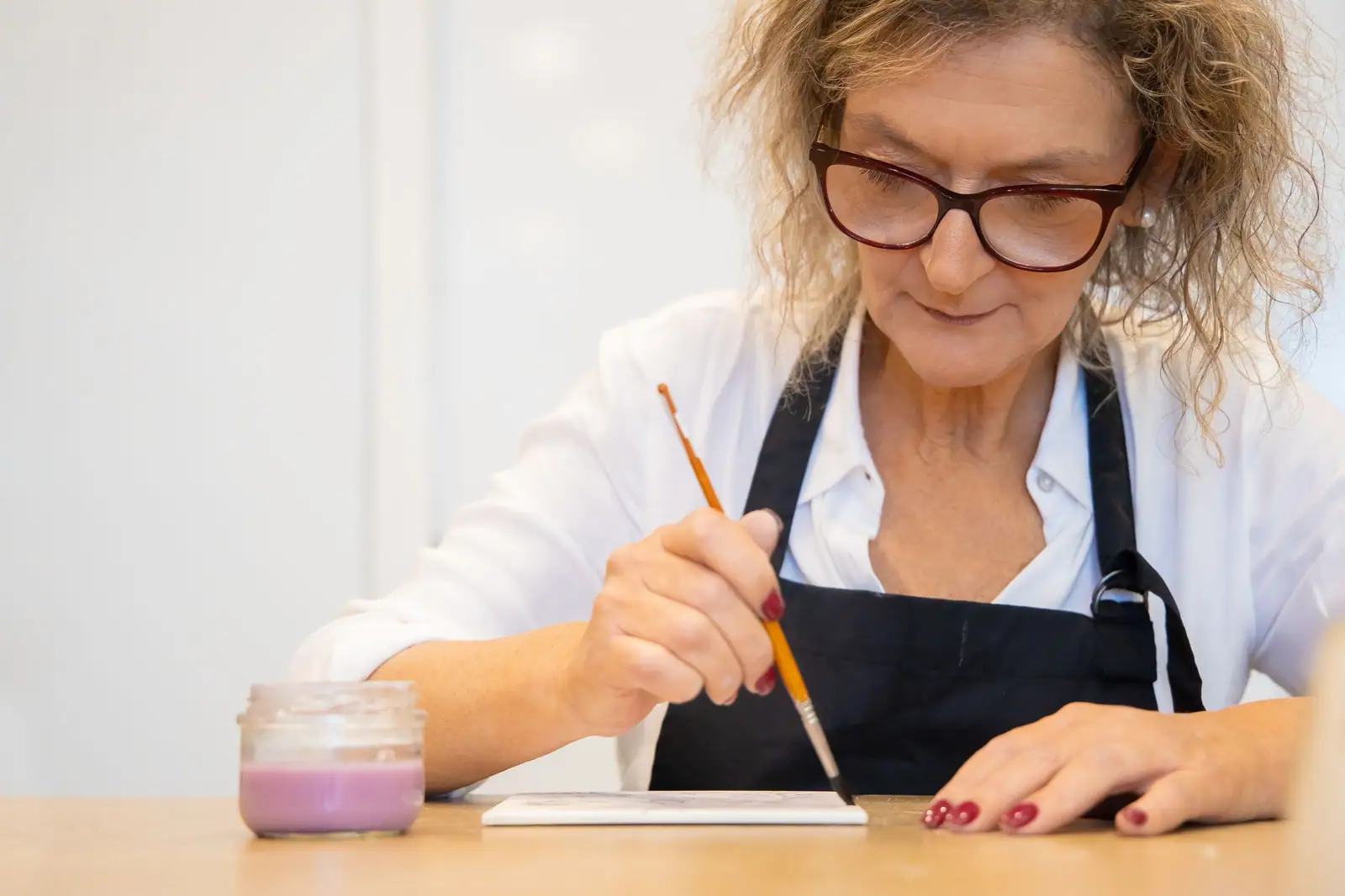A resident painting at the watercolor class