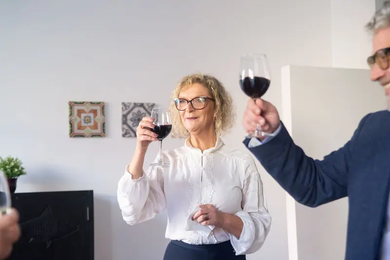 Neighbors toasting at a Thursday tasting